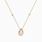 The Aurora 14K Yellow Gold Opal and Diamond Necklace showcases a teardrop opal pendant accented by two round diamonds, offering an elegant look with subtle diamond details.