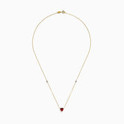 The Ruby Royale 14K Yellow Gold Ruby and Diamond Heart Necklace features a red heart-shaped pendant with a round diamond on each side, displayed on a white background.