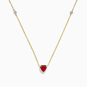 The Ruby Royale 14K Yellow Gold Ruby and Diamond Heart Necklace features a red heart-shaped pendant with a round diamond on each side, displayed on a white background.