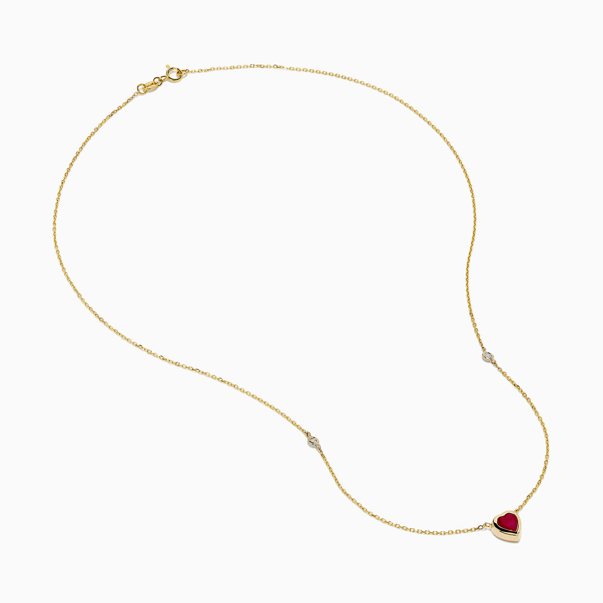 The Ruby Royale 14K Yellow Gold Ruby and Diamond Heart Necklace features a red heart-shaped pendant with a round diamond on each side, displayed on a white background.