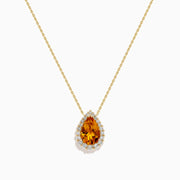 The Sunset 14K Yellow Gold Citrine and Diamond Pear Pendant features a pear-shaped citrine surrounded by sparkling diamonds on a yellow gold chain, displayed against a white background.