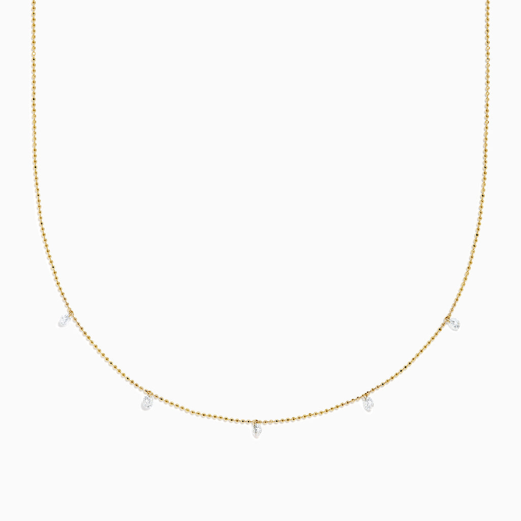 The 14K Yellow Gold Floating Diamonds Beaded Chain Necklace features five small, evenly spaced clear gemstones on a delicate yellow gold chain.