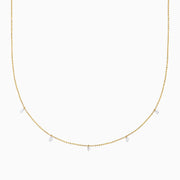 The 14K Yellow Gold Floating Diamonds Beaded Chain Necklace features five small, evenly spaced clear gemstones on a delicate yellow gold chain.