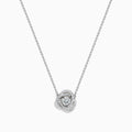 The 18K White Gold Diamond Love Knot Necklace features a central round diamond pendant encircled by intertwining loops of smaller diamonds in a stunning knot-inspired design.