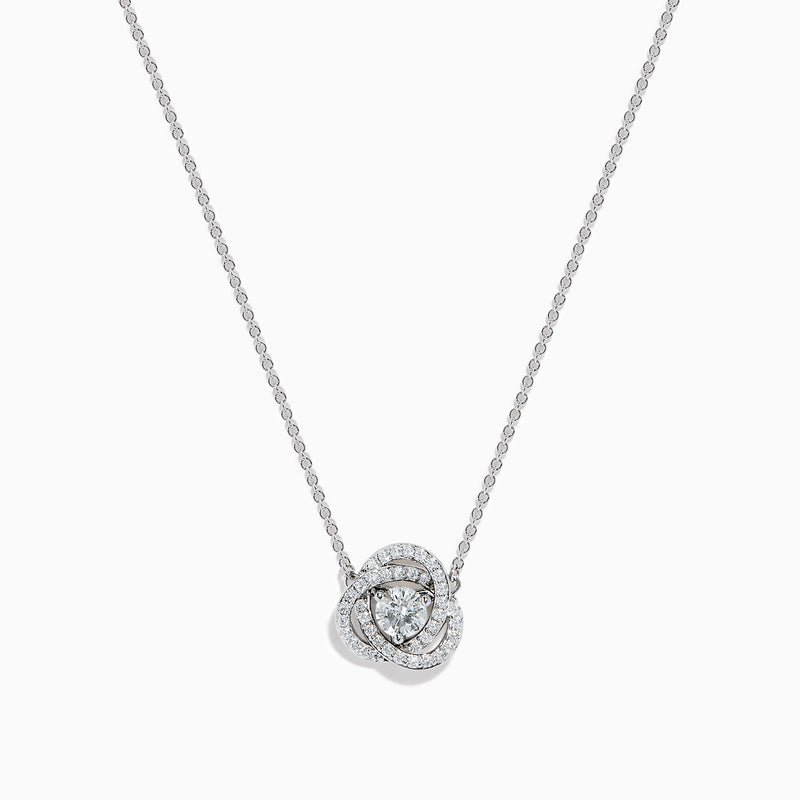 The 18K White Gold Diamond Love Knot Necklace features a central round diamond pendant encircled by intertwining loops of smaller diamonds in a stunning knot-inspired design.