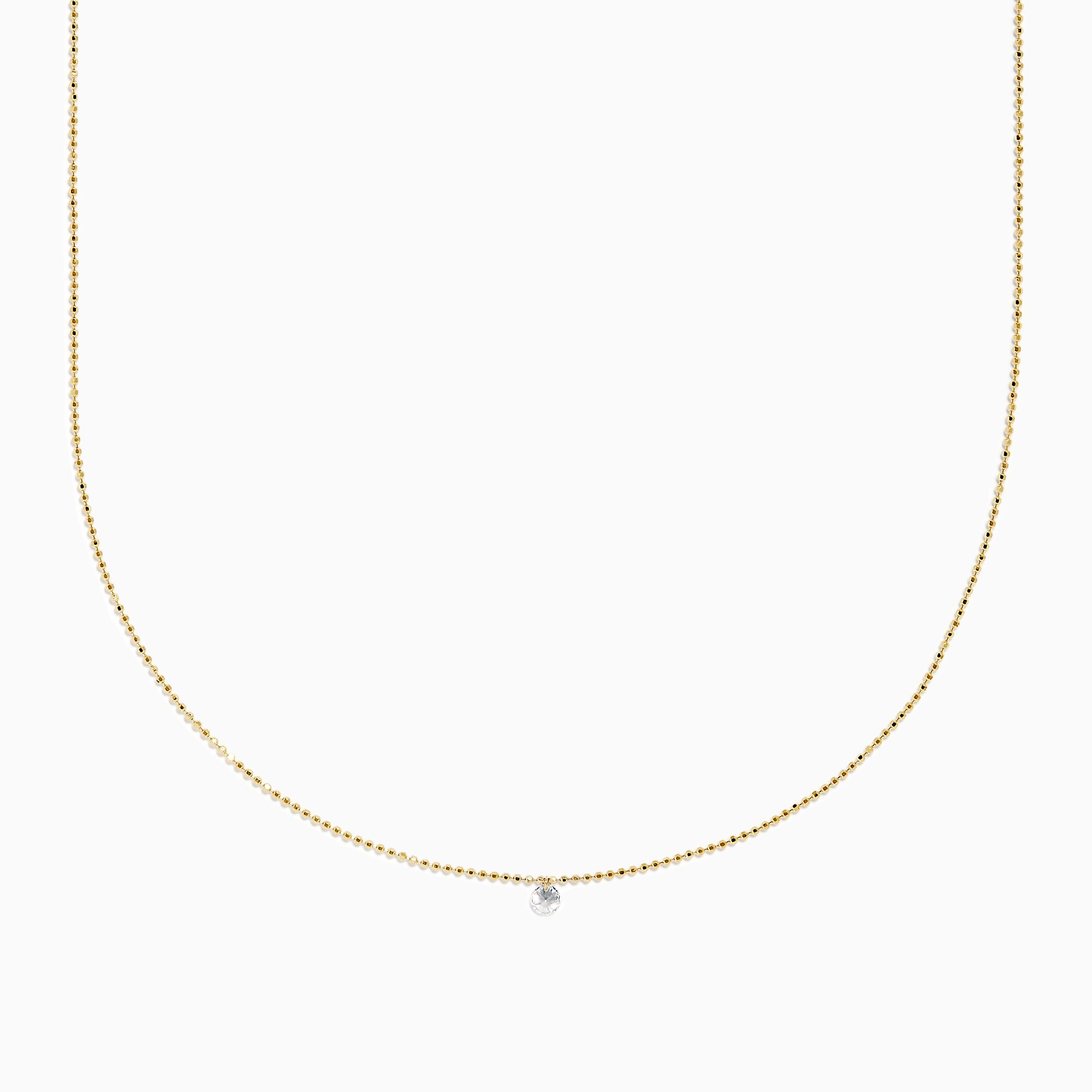 The 14K Yellow Gold Floating Diamond Solitaire Beaded Chain Necklace showcases a small round diamond pendant at the center, set against a plain white background.