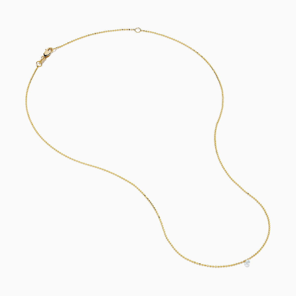 The 14K Yellow Gold Floating Diamond Solitaire Beaded Chain Necklace showcases a small round diamond pendant at the center, set against a plain white background.