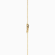 The 14K Yellow Gold Floating Diamond Solitaire Beaded Chain Necklace showcases a small round diamond pendant at the center, set against a plain white background.