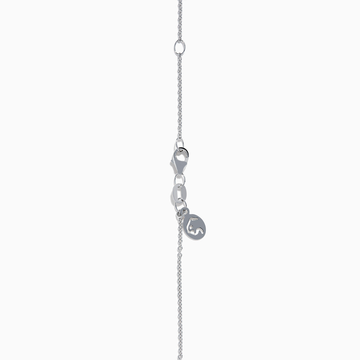 The 14K White Gold Tanzanite and Diamond Halo Pendant showcases a round tanzanite encircled by sparkling diamonds, set on a delicate chain, against a white background.