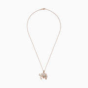 Signature 14K Rose Gold Diamond and Emerald Panther Pendant featuring a prowling panther with green eyes, black nose, and clear gemstone accents, shown on a white background.