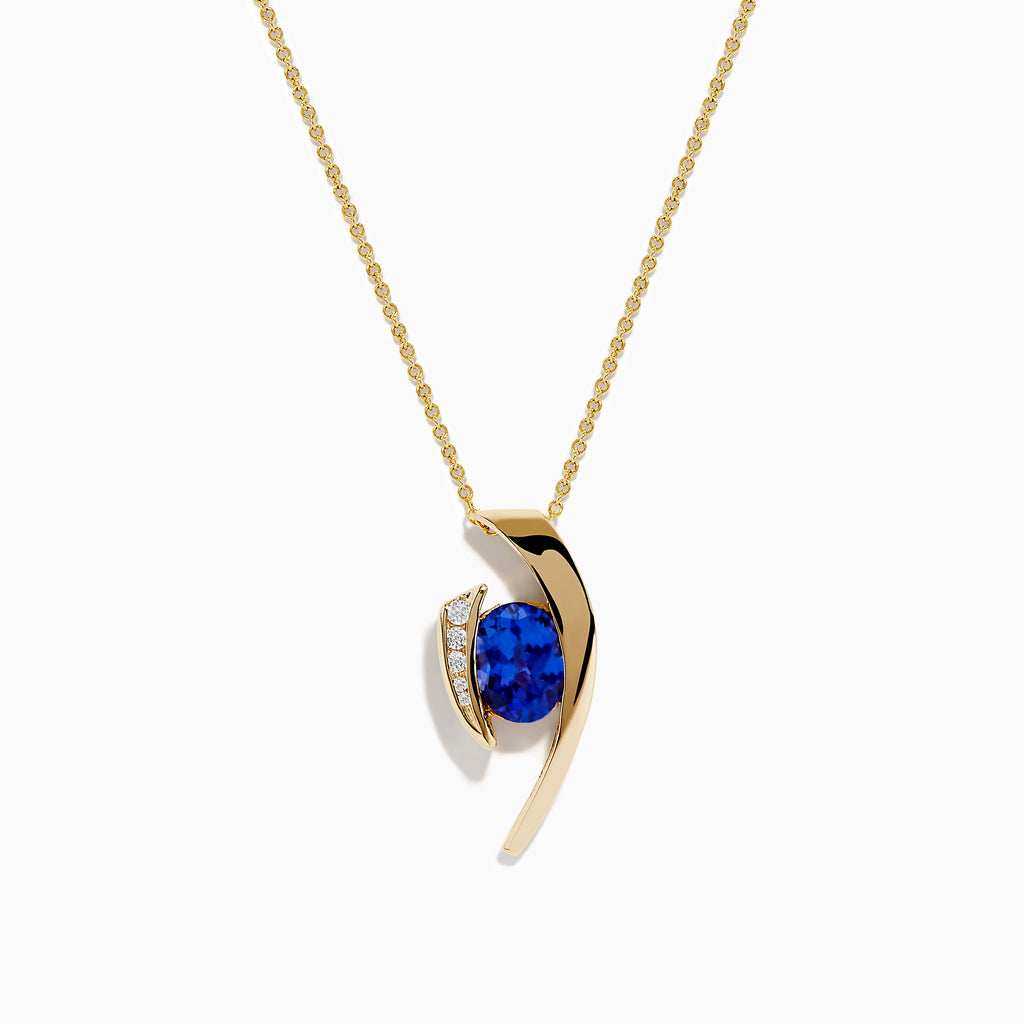 The Nahla Siri 14K Yellow Gold Floating Tanzanite and Diamond Pendant features a vibrant tanzanite gemstone and sparkling diamonds set in a curved gold pendant, displayed on a classic gold chain against a white background.