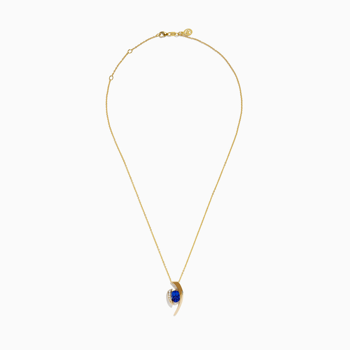 The Nahla Siri 14K Yellow Gold Floating Tanzanite and Diamond Pendant features a vibrant tanzanite gemstone and sparkling diamonds set in a curved gold pendant, displayed on a classic gold chain against a white background.