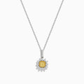 The Canare 18K Two Tone Gold White and Yellow Diamond Pendant features a yellow diamond framed by a halo of white diamonds, set on a fine chain.