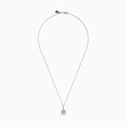 The Canare 18K Two Tone Gold White and Yellow Diamond Pendant features a yellow diamond framed by a halo of white diamonds, set on a fine chain.