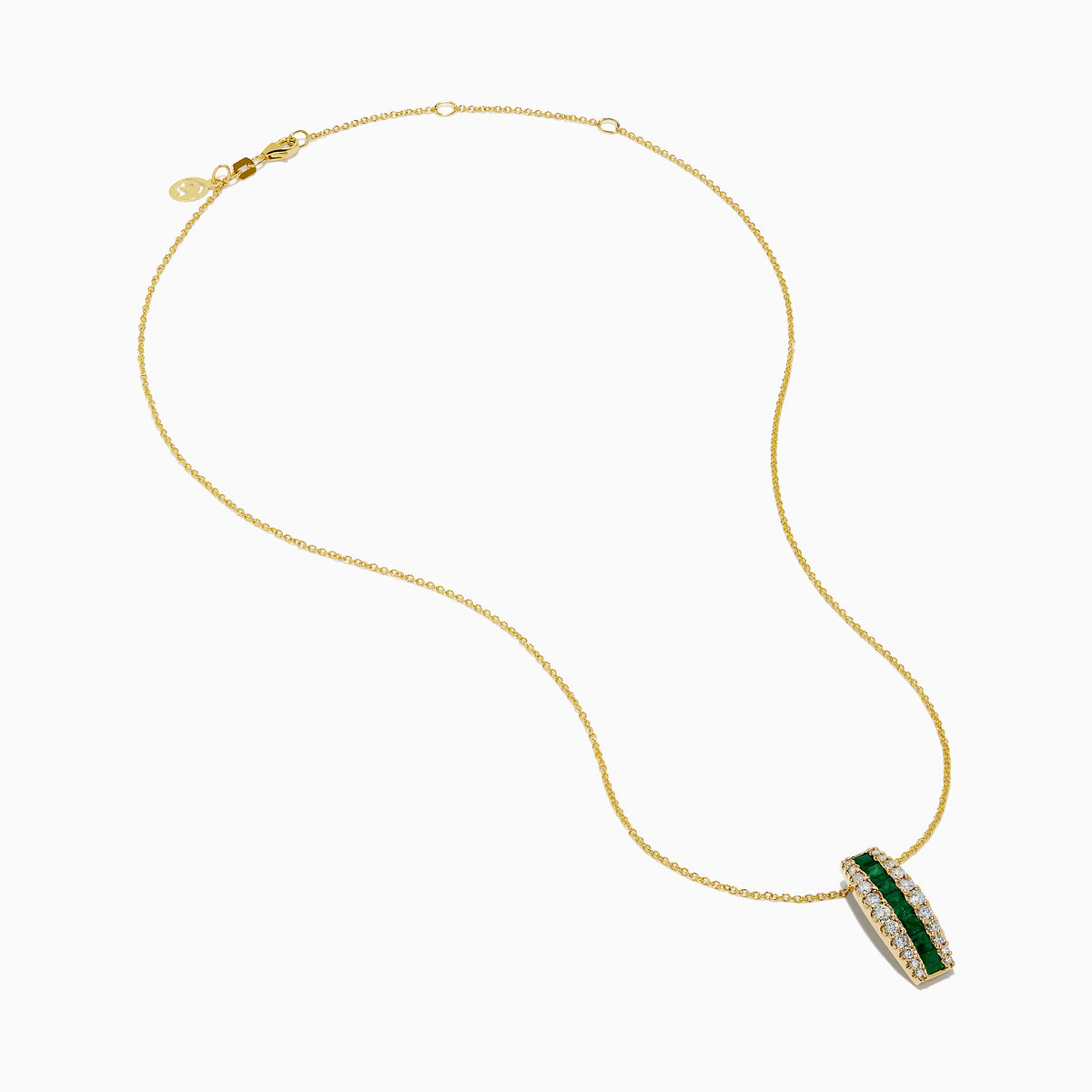 The 14K Yellow Gold Emerald and Diamond Pendant features a vertical row of emeralds flanked by diamonds, hanging from a delicate gold chain against a white background.