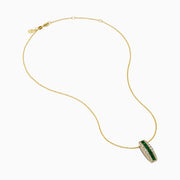 The 14K Yellow Gold Emerald and Diamond Pendant features a vertical row of emeralds flanked by diamonds, hanging from a delicate gold chain against a white background.