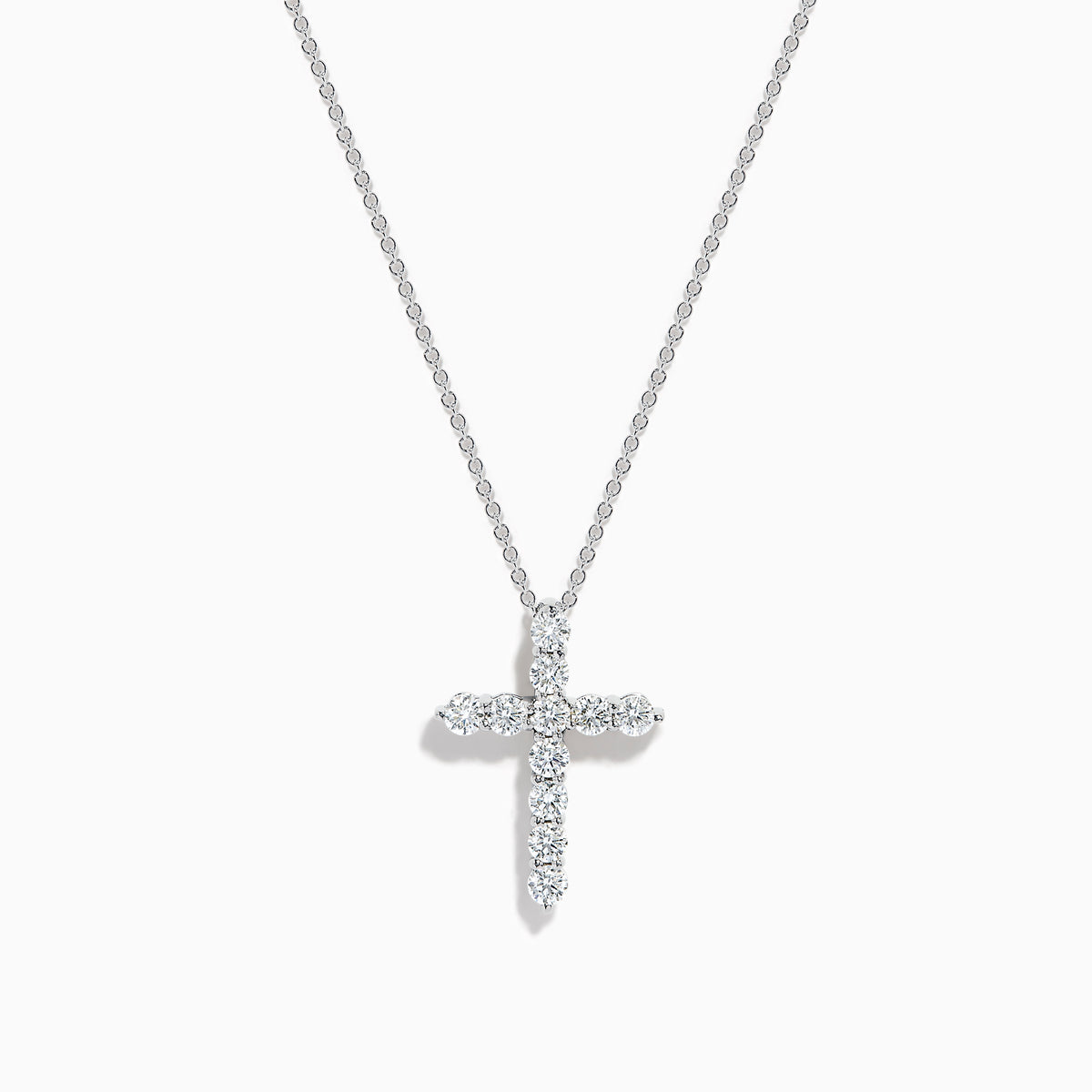 The 14K White Gold Diamond Cross Pendant features a delicate white gold chain and a cross encrusted with sparkling round diamonds, shown against a plain white background.
