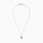 The 14K Rose Gold Pink Sapphire and Diamond Swirl Pendant features a teardrop swirl design with a central pink sapphire encircled by two rows of sparkling white diamonds.