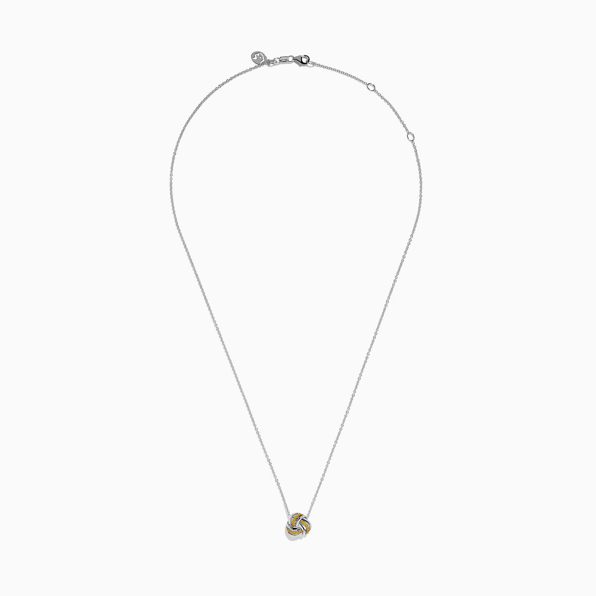 A 14K white gold love knot pendant with yellow diamonds hangs on a delicate chain, showcased against a white background.