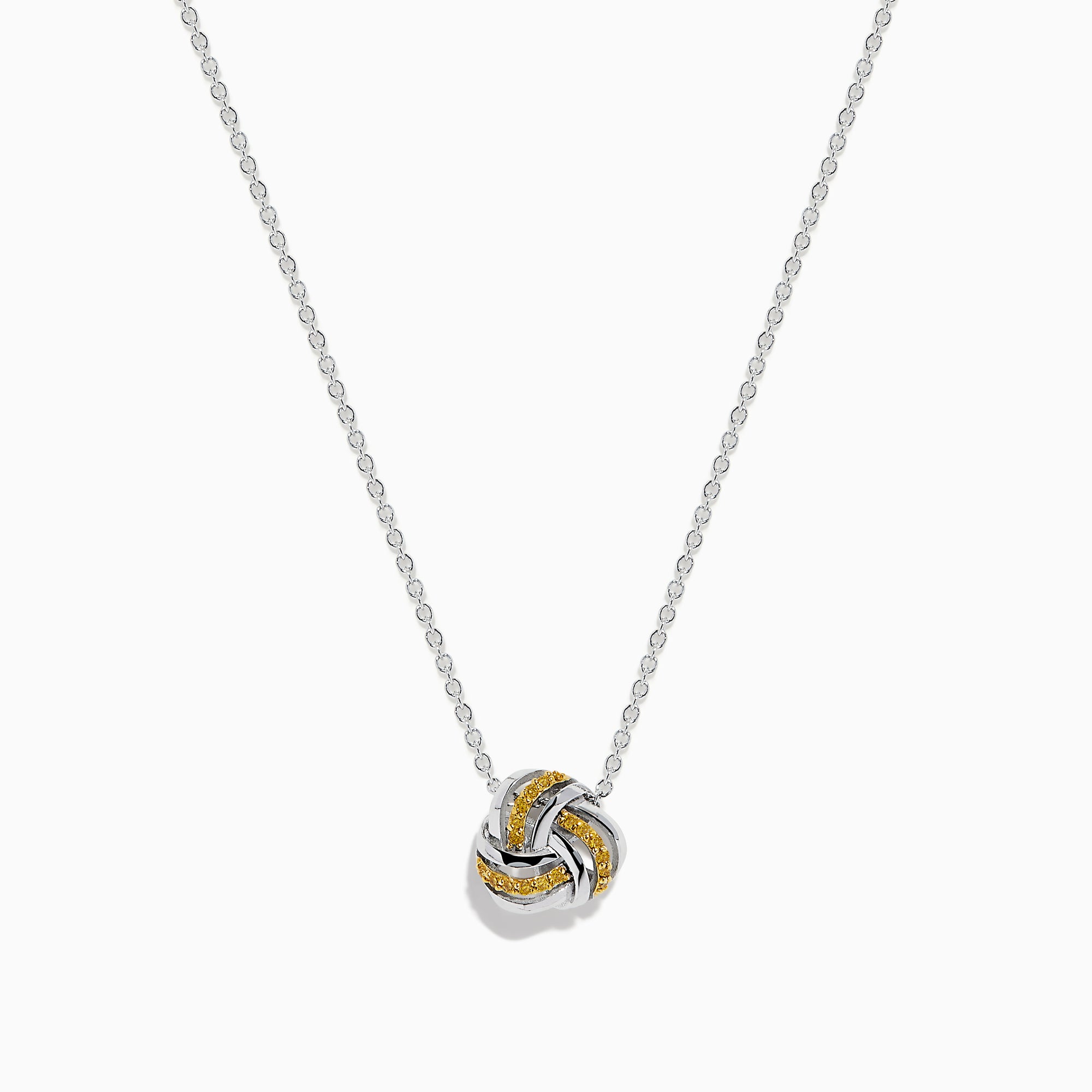 A 14K white gold love knot pendant with yellow diamonds hangs on a delicate chain, showcased against a white background.