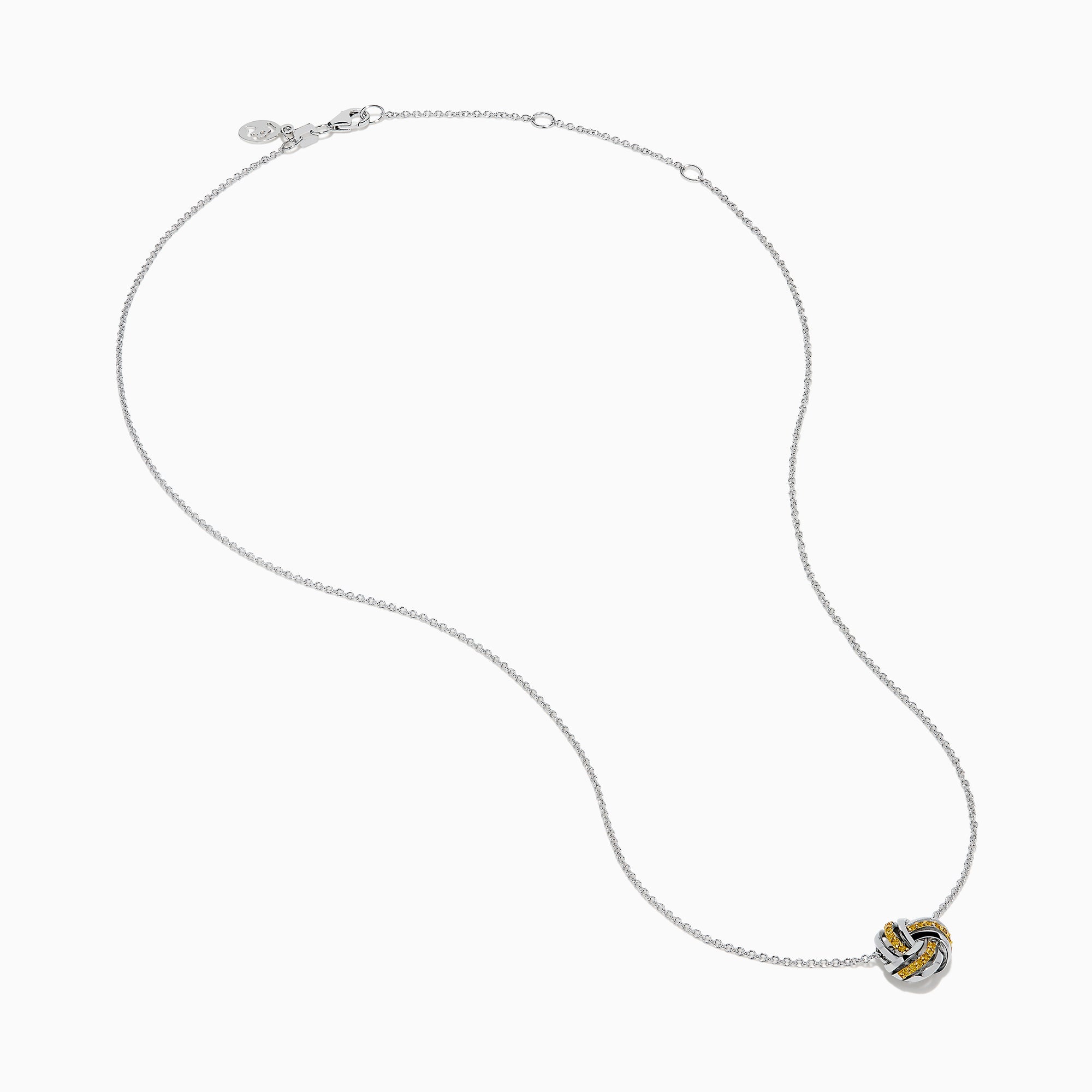 A 14K white gold love knot pendant with yellow diamonds hangs on a delicate chain, showcased against a white background.