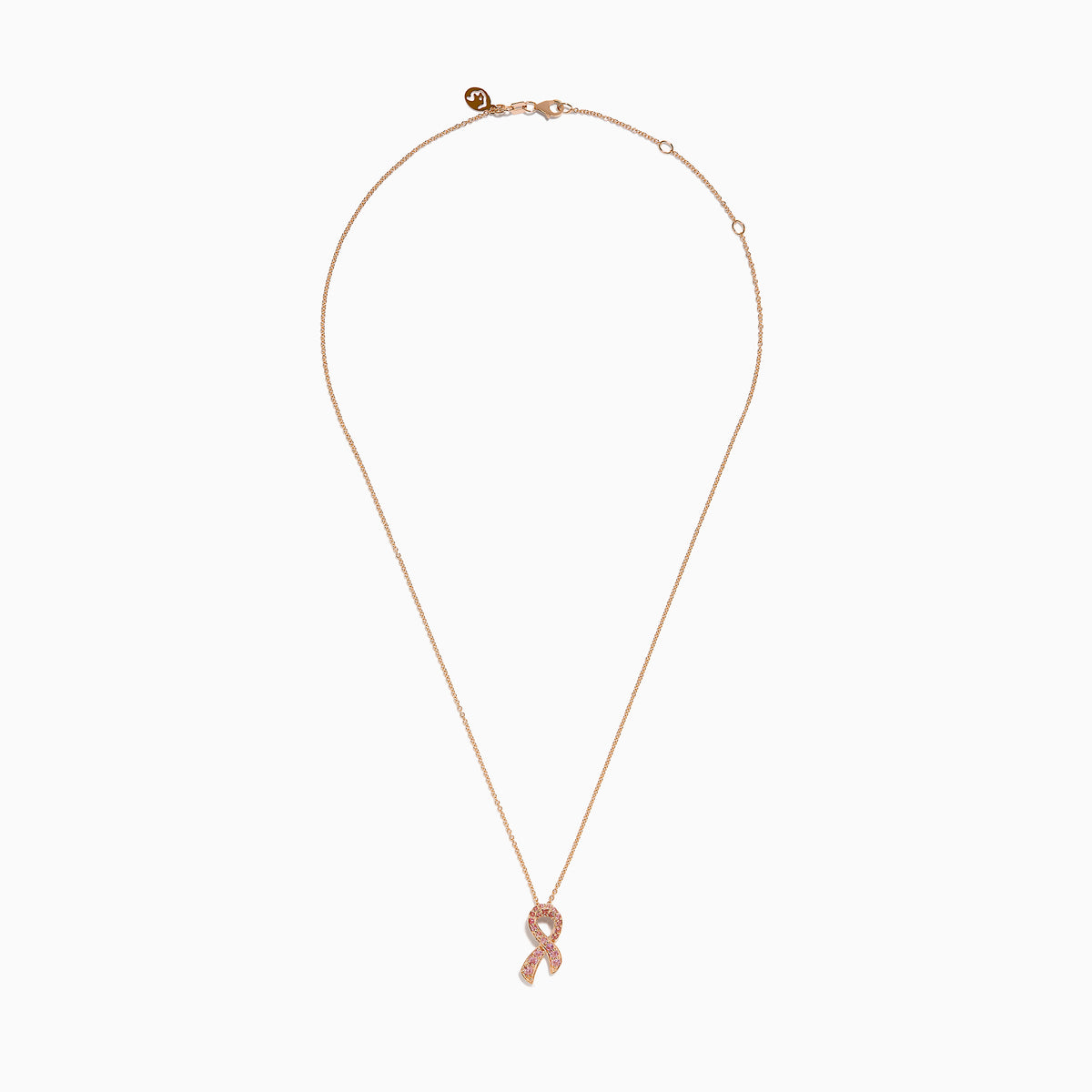 The 14K Rose Gold Pink Sapphire Ribbon Pendant features a pink ribbon-shaped charm encrusted with sparkling pink sapphires on a gold chain, displayed on a white background for a delicate, feminine look.