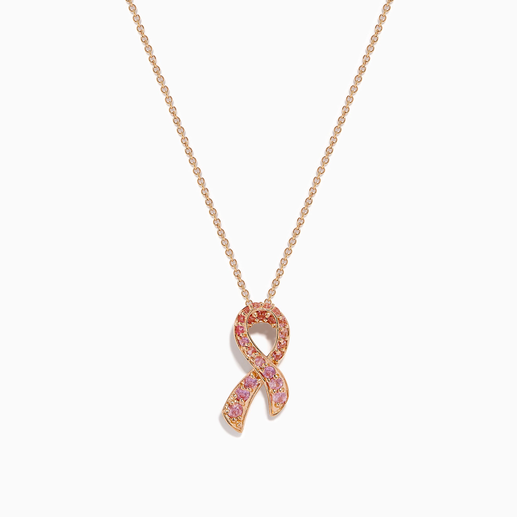 The 14K Rose Gold Pink Sapphire Ribbon Pendant features a pink ribbon-shaped charm encrusted with sparkling pink sapphires on a gold chain, displayed on a white background for a delicate, feminine look.