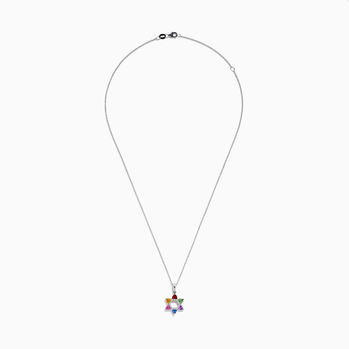 The Watercolors 14K White Gold Multi Color Sapphire and Diamond Star of David Pendant features six sapphires in red, orange, yellow, green, blue, and purple. It hangs from a delicate silver chain against a white background.