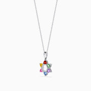 The Watercolors 14K White Gold Multi Color Sapphire and Diamond Star of David Pendant features six sapphires in red, orange, yellow, green, blue, and purple. It hangs from a delicate silver chain against a white background.