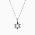 The Watercolors 14K White Gold Multi Color Sapphire and Diamond Star of David Pendant features six sapphires in red, orange, yellow, green, blue, and purple. It hangs from a delicate silver chain against a white background.