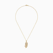 The Signature 14K Yellow Gold Sapphire and Diamond Panther Necklace features a panther-shaped pendant with sparkling diamond accents and vivid sapphire-blue eyes, all on a delicate gold chain, shown against a white background.