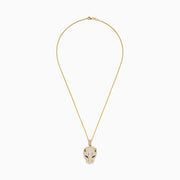 The Signature 14K Yellow Gold Sapphire and Diamond Panther Pendant features a panther’s head encrusted with diamonds and striking sapphire gemstone eyes, elegantly suspended from a matching chain necklace.