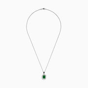 The Brasilica 14K Two-Tone Gold Emerald and Diamond Pendant features a rectangular emerald framed by sparkling diamonds, offering an elegant look reminiscent of a classic diamond pendant against a plain white background.