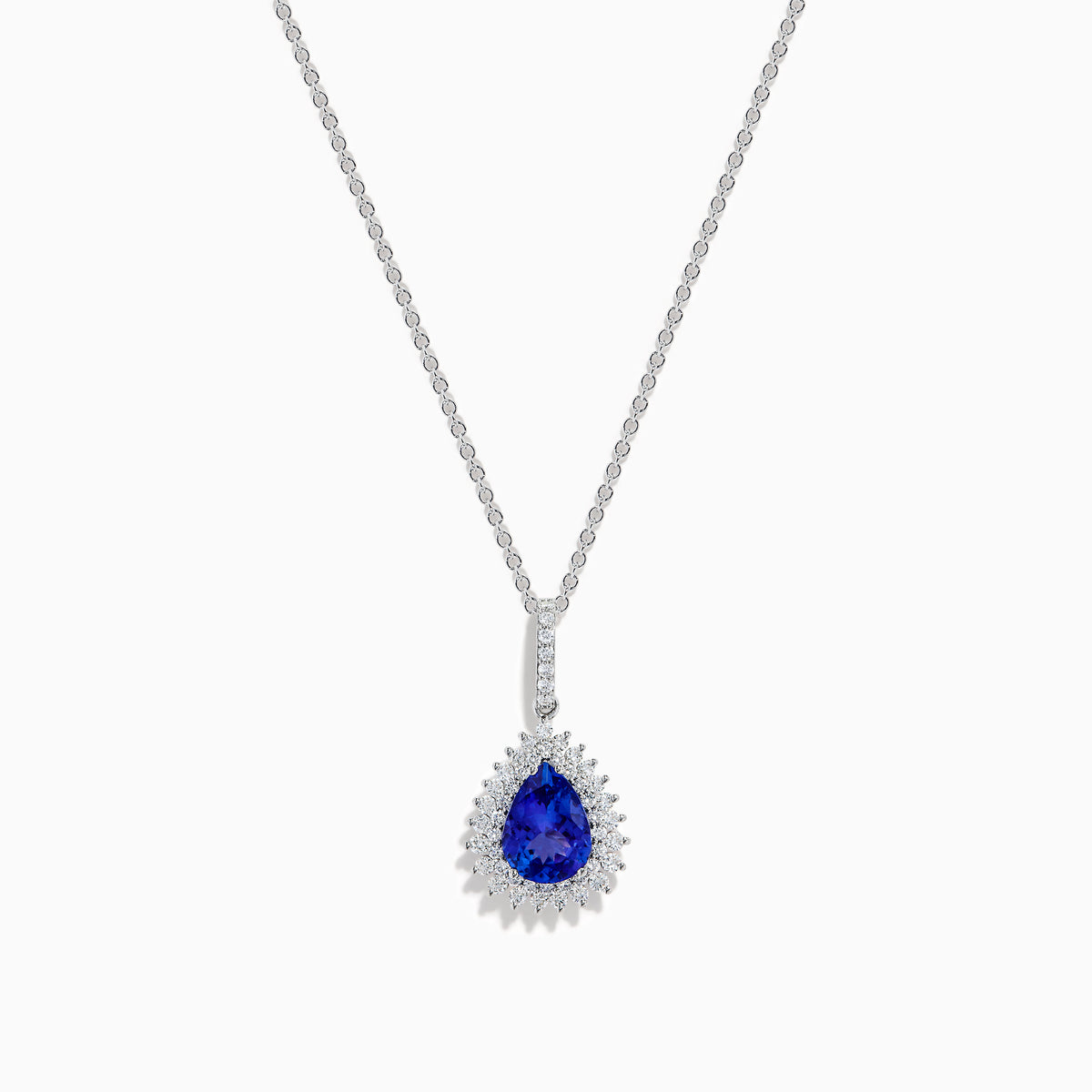 A 14K white gold pear tanzanite and diamond halo pendant with a diamond-studded bail, displayed on a white background.