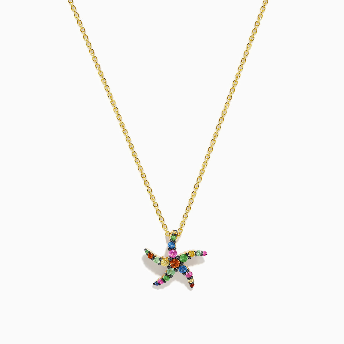 The Seaside 14K Yellow Gold Multi Sapphire Starfish Pendant features a delicate gold chain with a sapphire starfish-shaped pendant adorned with multicolored gemstones, shown elegantly against a white background.