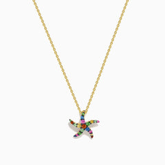 The Seaside 14K Yellow Gold Multi Sapphire Starfish Pendant features a delicate gold chain with a sapphire starfish-shaped pendant adorned with multicolored gemstones, shown elegantly against a white background.