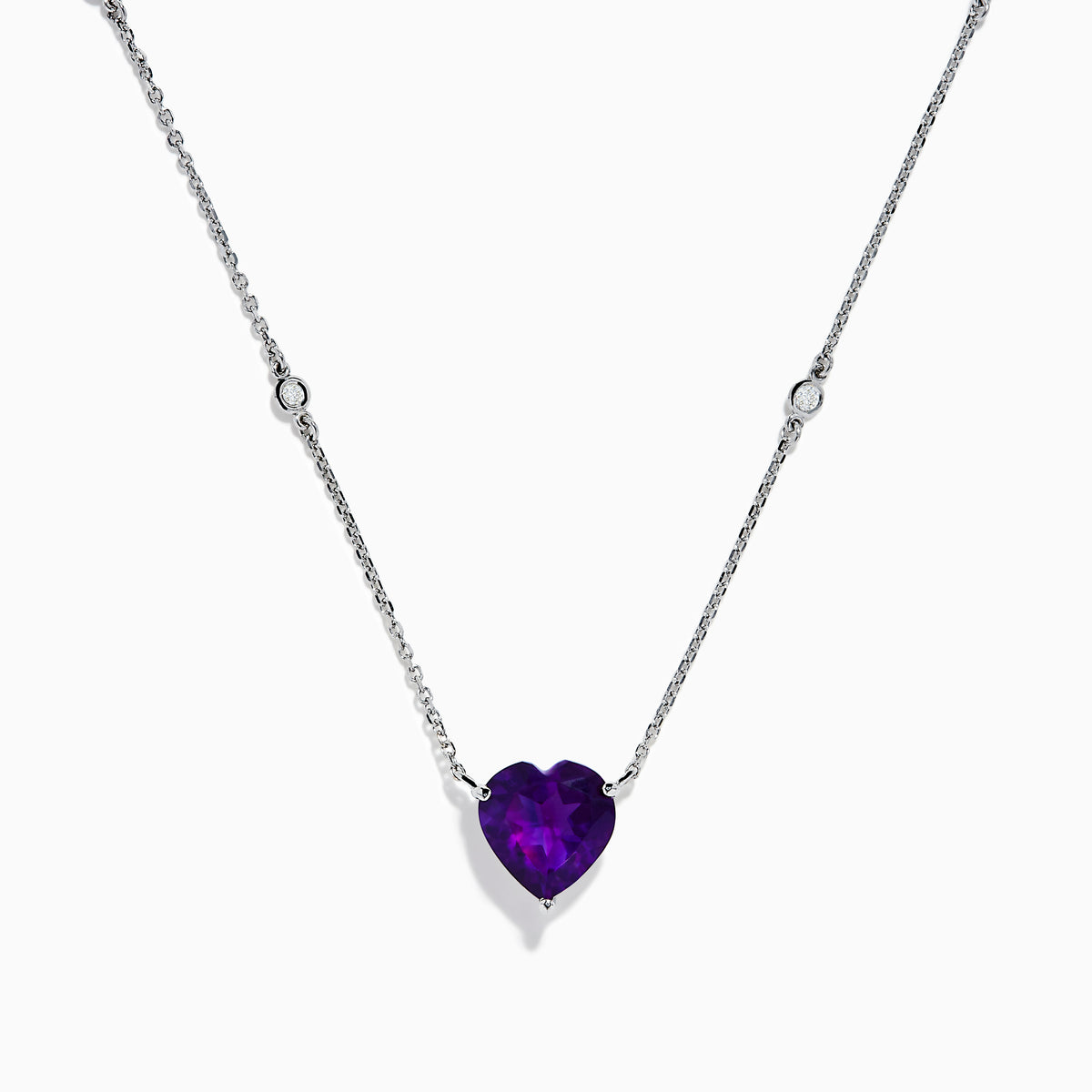 The Aquarius 14K White Gold Aquamarine and Diamond Heart Necklace features a heart-shaped aquamarine pendant with two small round diamonds set along its delicate chain.