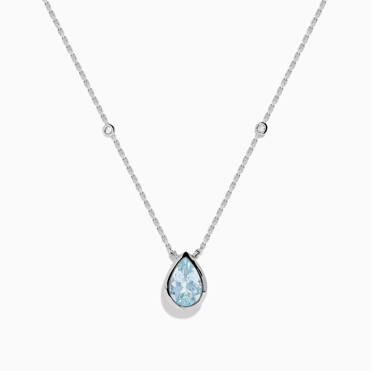 The Aquarius 14K Yellow Gold Aquamarine Necklace features a teardrop-shaped light blue gemstone pendant and small round crystal accents along the chain—an elegant gift, beautifully displayed on a white background.