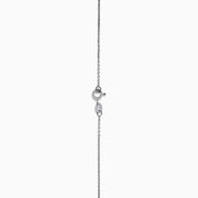 The Aquarius 14K Yellow Gold Aquamarine Necklace features a teardrop-shaped light blue gemstone pendant and small round crystal accents along the chain—an elegant gift, beautifully displayed on a white background.