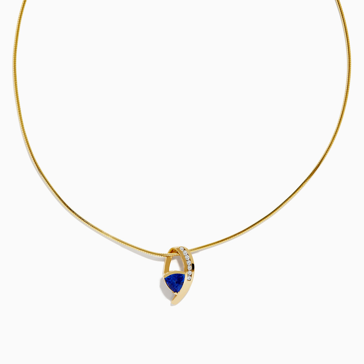 The Nahla Siri 14K Yellow Gold Tanzanite and Diamond Necklace features a delicate chain and a blue tanzanite gemstone pendant, accented with sparkling diamonds, displayed on a white background.
