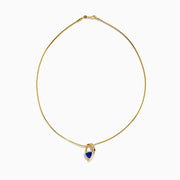 The Nahla Siri 14K Yellow Gold Tanzanite and Diamond Necklace features a delicate chain and a blue tanzanite gemstone pendant, accented with sparkling diamonds, displayed on a white background.