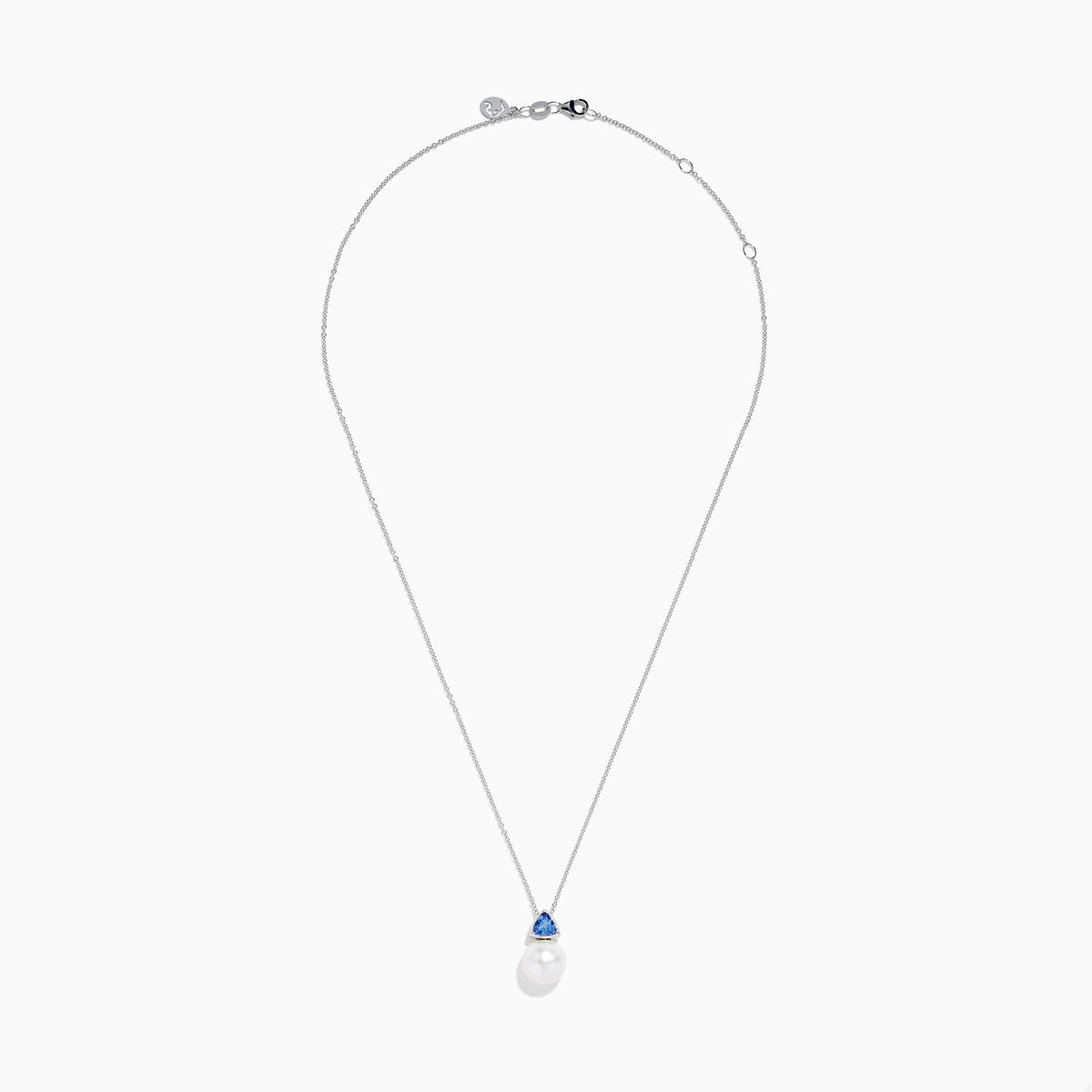 The Nahla 14K White Gold Fresh Water Pearl and Tanzanite Pendant features a round pearl accented with a small, triangular blue tanzanite, all set in white gold and shown against a plain white background.