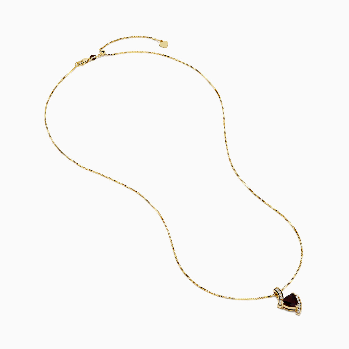 The 14K Yellow Gold Garnet and Diamond Pendant features a deep red, triangular garnet accented with small diamonds in a curved, asymmetrical design.