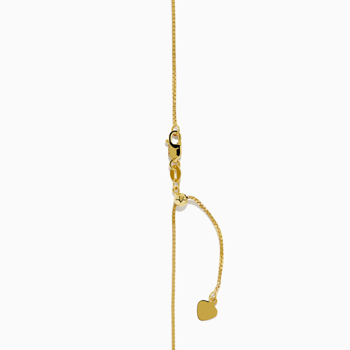 The 14K Yellow Gold Garnet and Diamond Pendant features a deep red, triangular garnet accented with small diamonds in a curved, asymmetrical design.