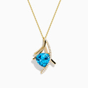 The Ocean Bleu 14K Yellow Gold Pendant features a triangular blue topaz accented with a curved row of small white diamonds and gold lines, suspended from a fine gold chain.
