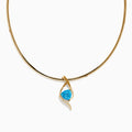 The Ocean Bleu 14K Yellow Gold Blue Topaz and Diamond Pendant features a twisting diamond design, centered with a vivid blue topaz and accented by small diamonds along one side, displayed on a plain white background.