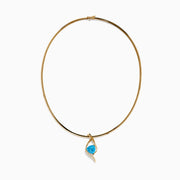 The Ocean Bleu 14K Yellow Gold Blue Topaz and Diamond Pendant features a twisting diamond design, centered with a vivid blue topaz and accented by small diamonds along one side, displayed on a plain white background.