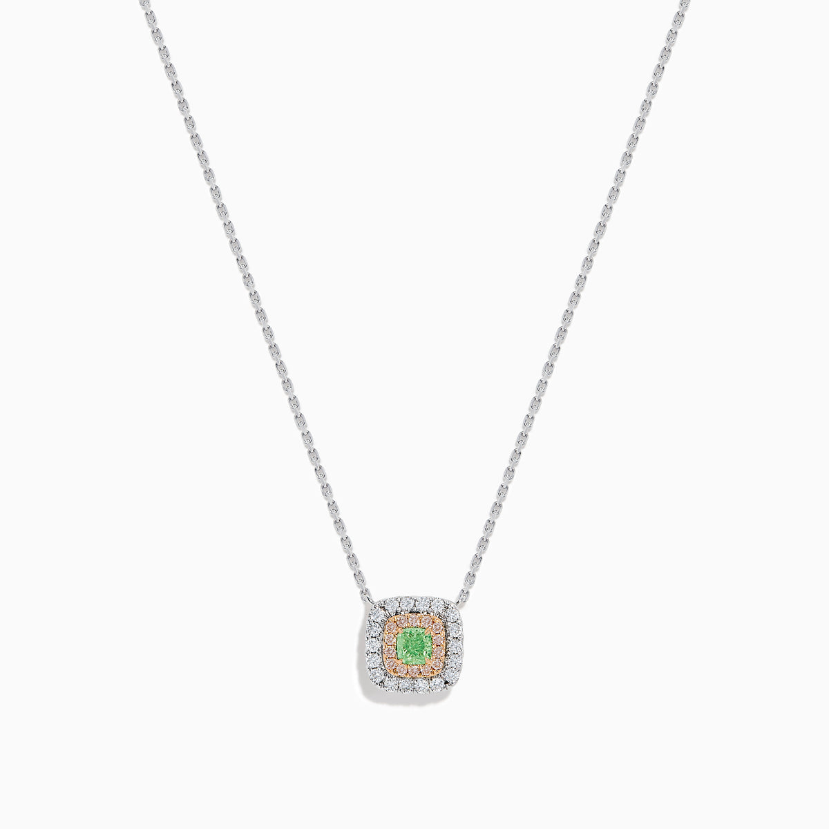 The 18K Two-Tone Gold Green and White Diamond Halo Necklace features a square pendant with a central green gemstone, accented by a double halo of sparkling white diamonds on a delicate chain.