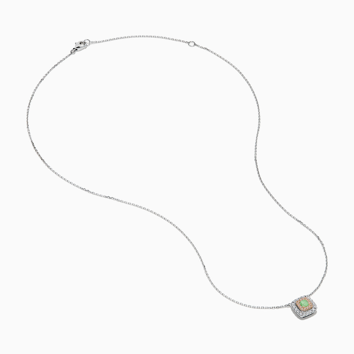 The 18K Two-Tone Gold Green and White Diamond Halo Necklace features a square pendant with a central green gemstone, accented by a double halo of sparkling white diamonds on a delicate chain.