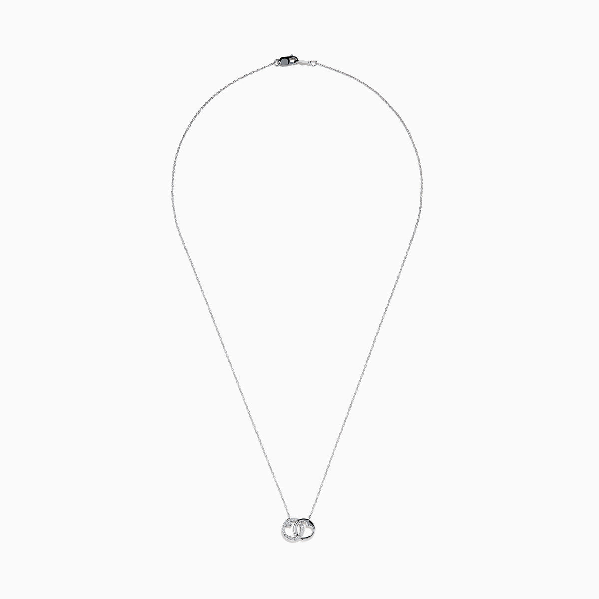 The 14K White Gold Diamond Accented Interlocking Hearts Necklace features two intertwined hearts—one with sparkling diamond accents, the other polished smooth—set on a plain white background.